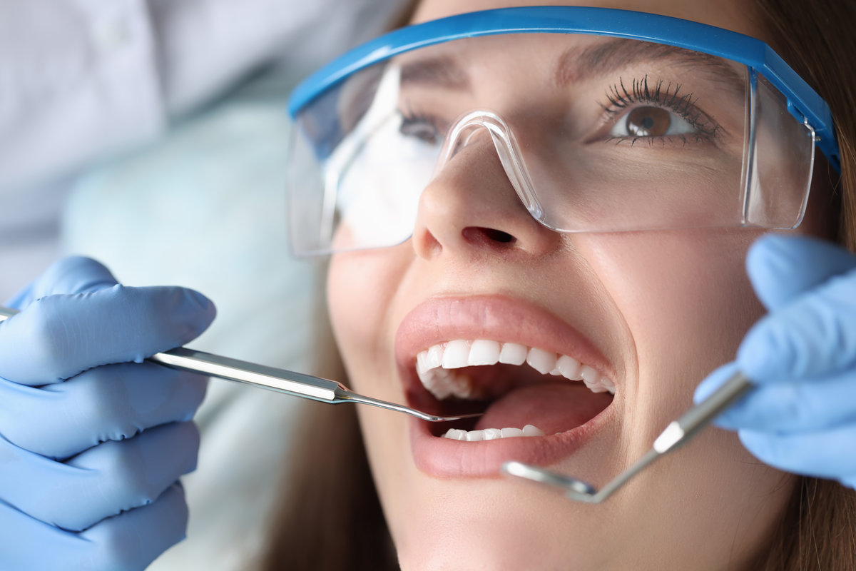 Dentist conducts medical examination of patient teeth. Dental clinic services concept